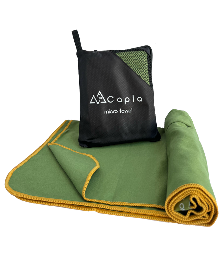 Green premium microfiber towel with yellow edging, lightweight and compact, perfect for outdoor activities and sports. Includes a black carry pouch.